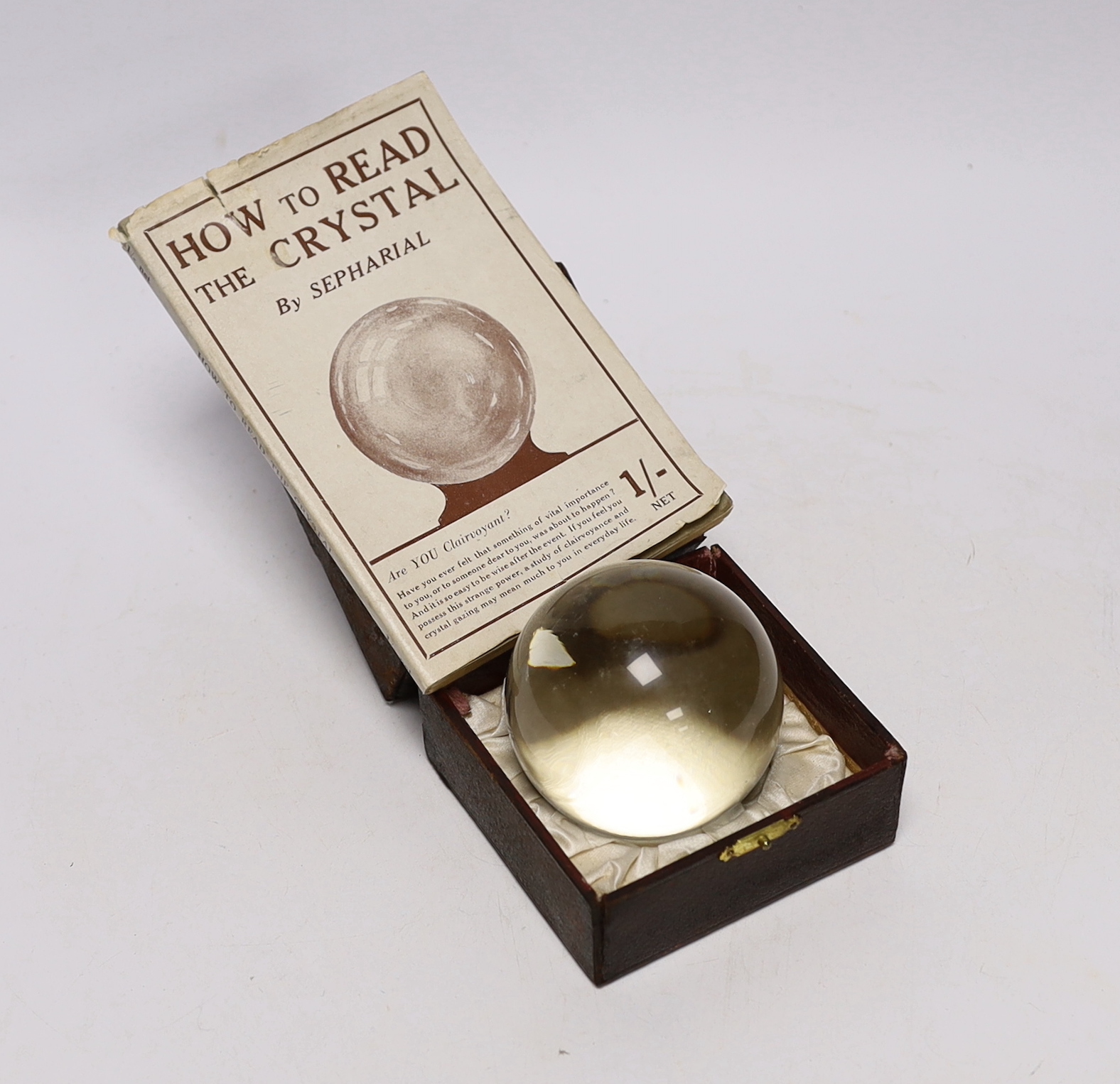 A Crystal Ball, together with ‘How to Read the Crystal or, Crystal and Seer, by Sepharial, 8vo, cloth with d/j, New York, c.1940